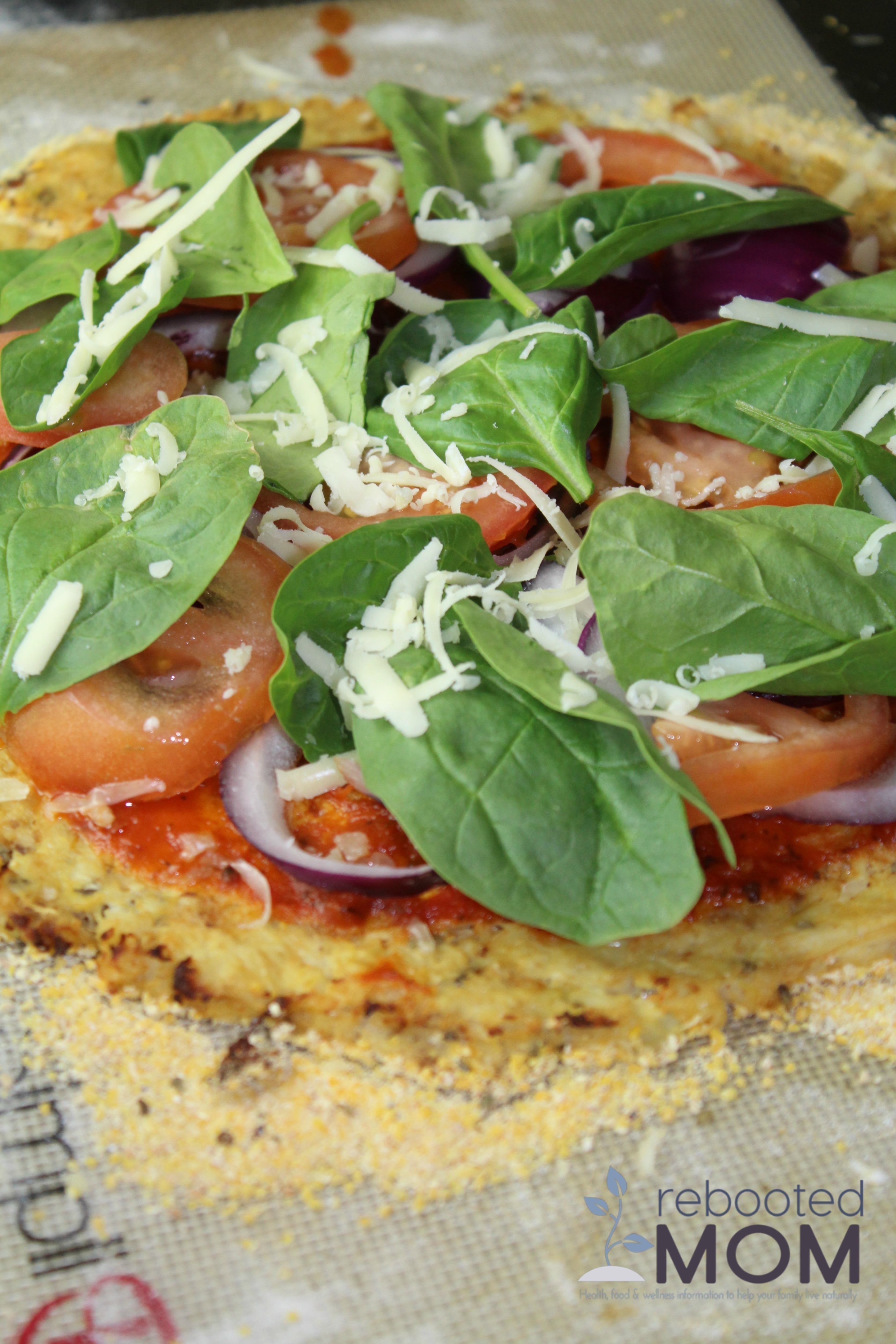 A simple cauliflower pizza crust that contains simple ingredients and easy-to-follow instructions. The finished crust is crispy on the outside and flavorful on the inside.