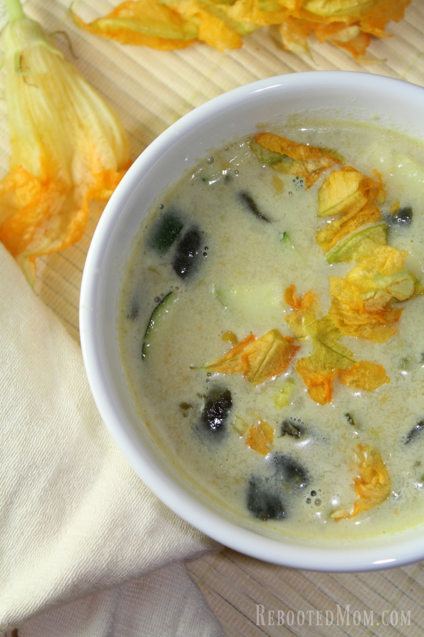 This rich and creamy Squash Blossom Soup uses Squash Blossoms and fresh summer produce to make a hearty and satisfying meal.