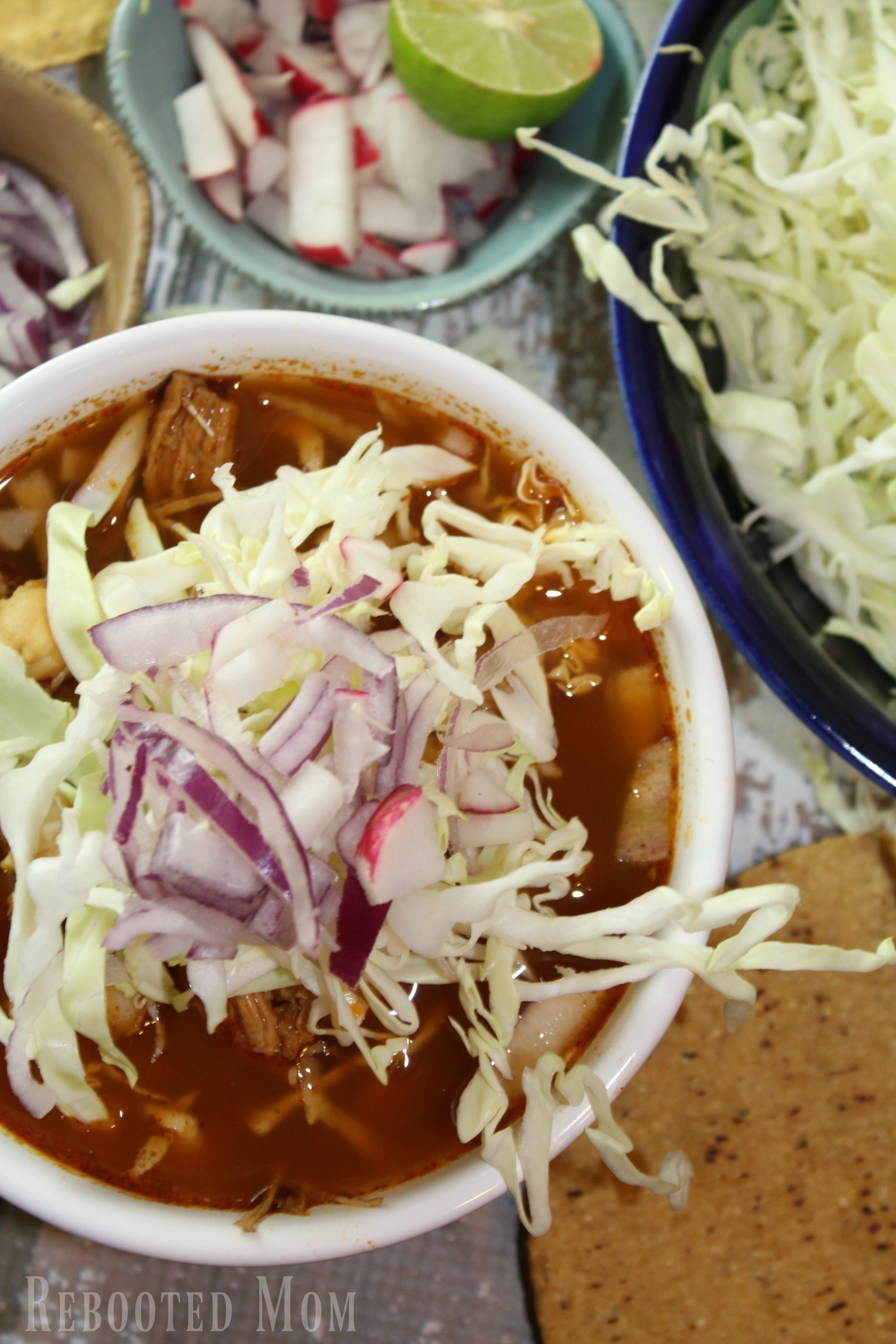 This Mexican stew features chiles and hominy, in a rich flavorsome broth. Dress up the stew with radishes, onions and sliced cabbage. It's traditional to serve the chicken in whole pieces but you can also pull it off the bone for even greater flavor.