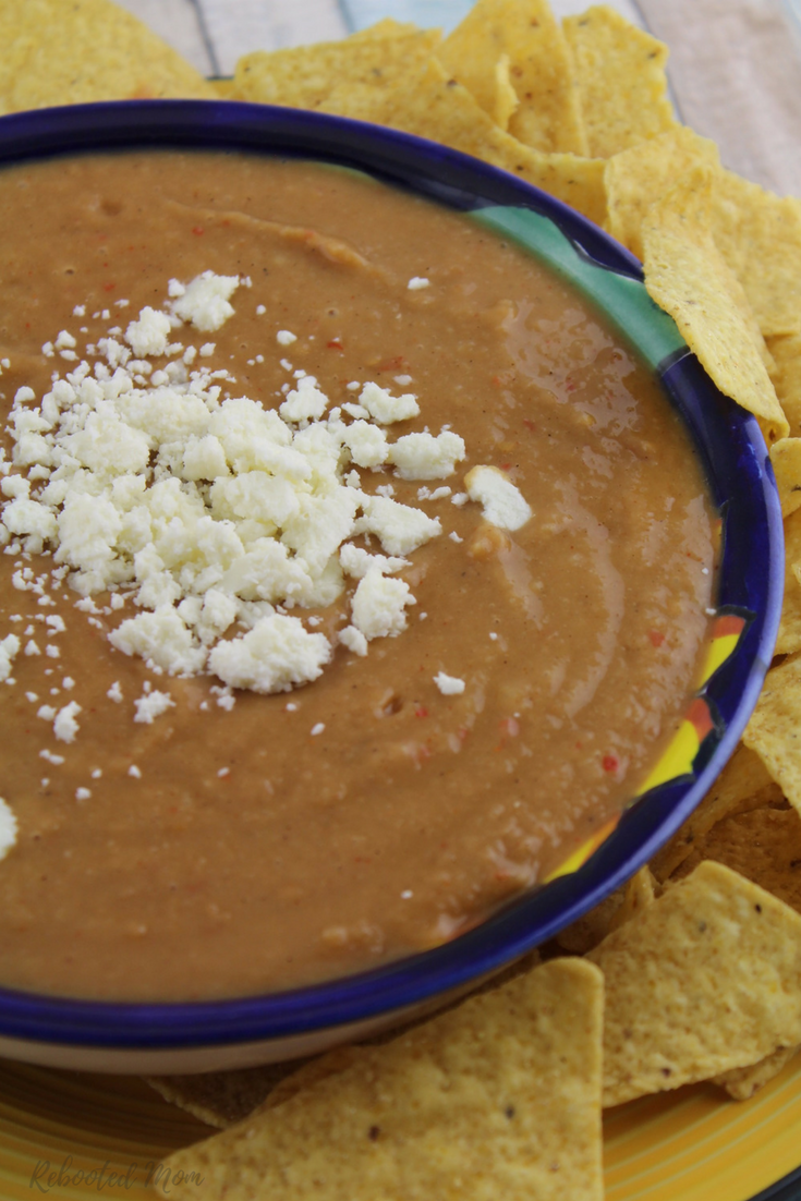 Combine a few simple ingredients together for this incredibly easy Mexican bean dip with lots of kick - serve with chips at your next get together or make for the kids to snack on.