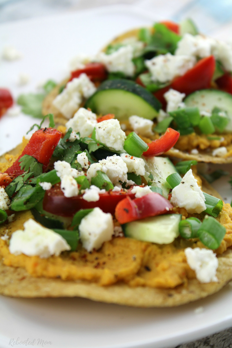 Go meatless with these healthy sweet potato and vegetable tostadas topped with chile lime seasoning.