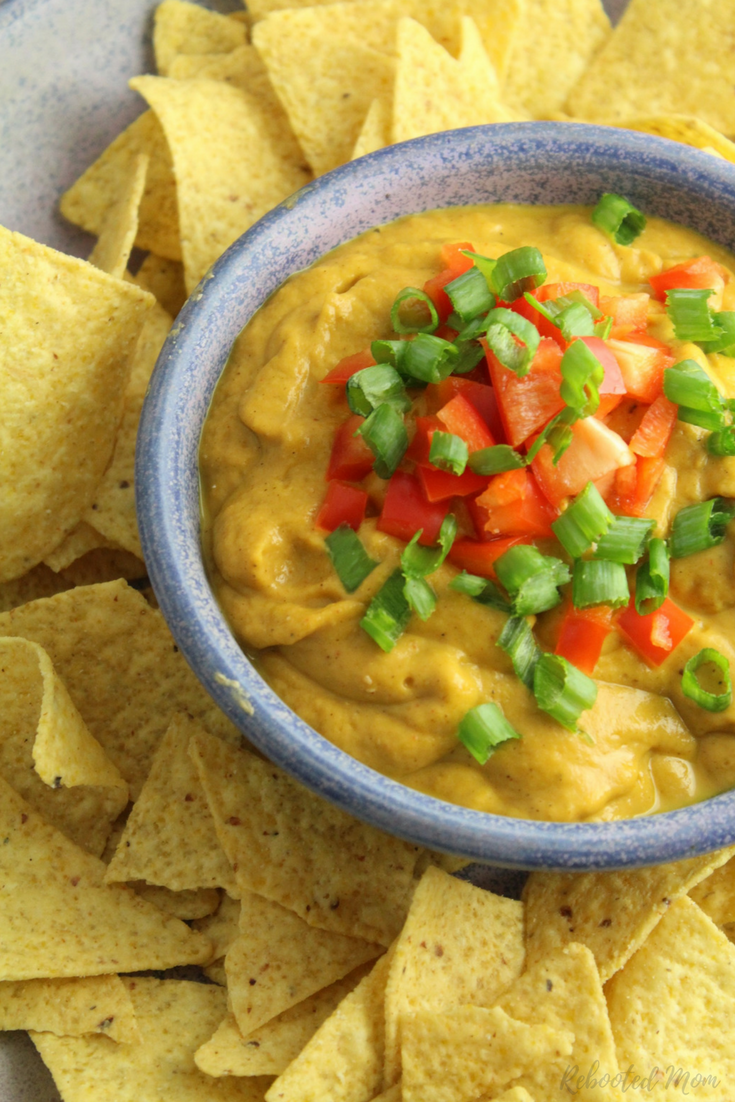 A no-guilt creamy queso sauce that is delicious as an appetizer or poured on burritos or enchiladas. Use your Instant Pot or stove top!  #gluten-free #vegan
