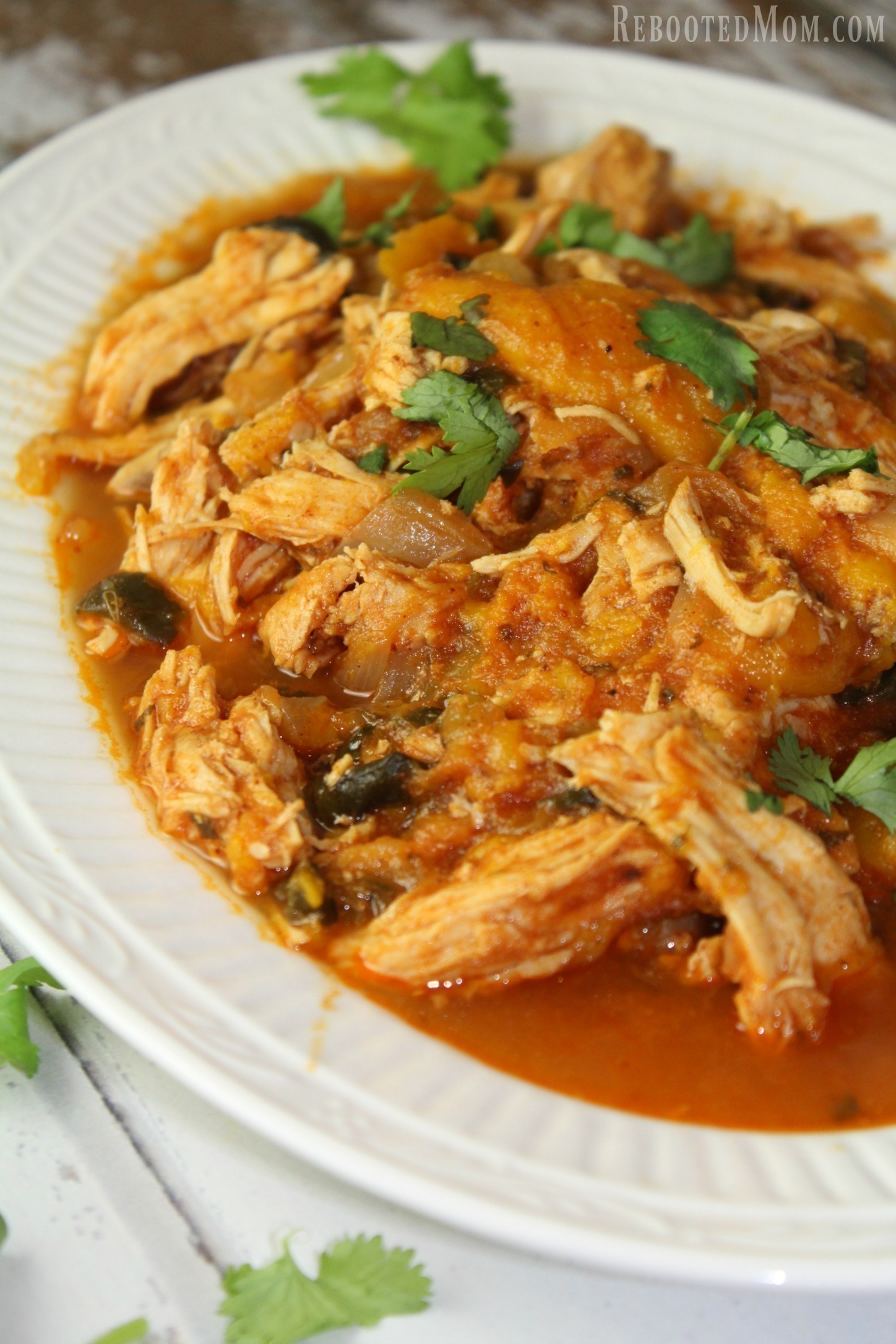 This Mango Lime Pulled Chicken is a one pot meal of shredded chicken that bathes in a fiery sauce of mangoes, tomatoes, and spices that's wonderful served over rice.