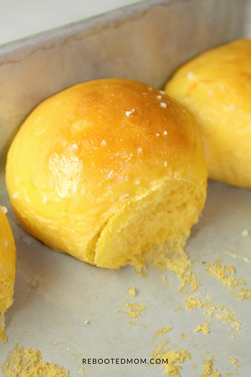 Sweet Potato Sea Salt Rolls that are light, fluffy and full of pumpkin flavor - the perfect accompaniment to Thanksgiving dinner or a bowl of hot soup!