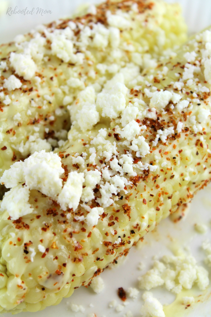 Elotes, or Mexican Street Corn, is corn on the cob dressed up with any or all of butter, mayonnaise, fresh cheese and chile lime seasoning - a MUST for summer!