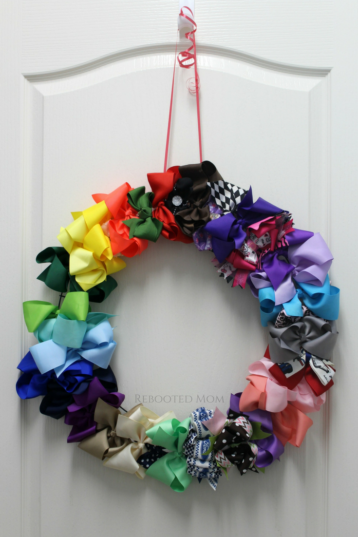 This DIY Hair Bow Wreath is the perfect solution to help organize a TON of hair bows! It takes a few dollars and less than 5 minutes to put together.