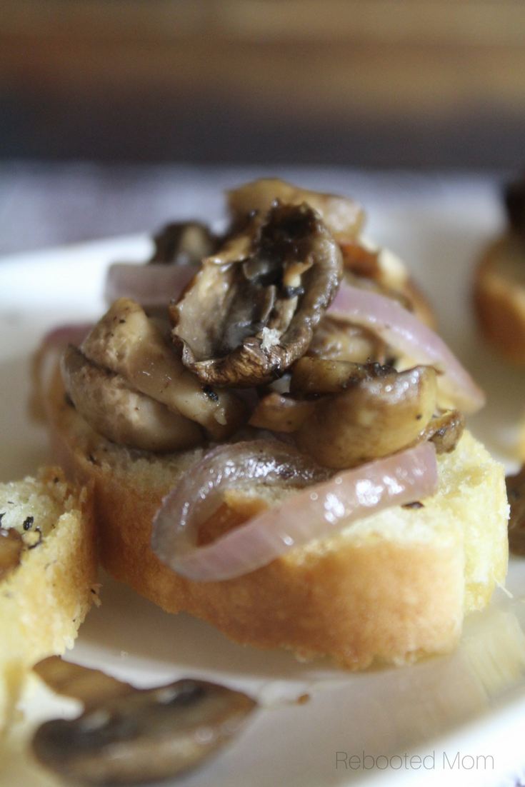 Mushrooms and onions combined with a splash of balsamic vinegar make a delicious combination when they are piled high on toasted baguettes and enjoyed as an easy appetizer. #mushrooms #bruschetta #appetizer