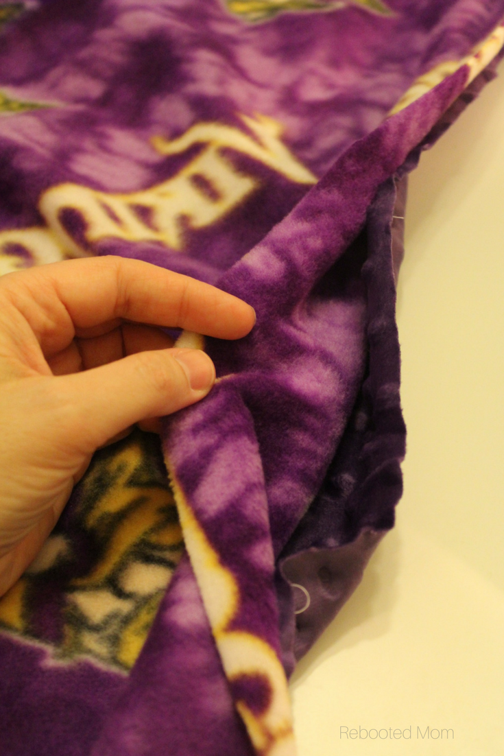This easy sew NFL cuddle blanket is the perfect handmade gift for a true football fan, and can be sewed in less than one hour!