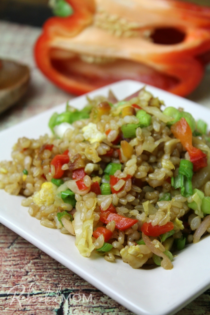 Combine a few simple vegetables with scrambled eggs and rice in this easy, healthy vegetable fried rice seasoned - it's soy-free and the perfect way to use up your odds and ends!  #friedrice #vegetables #easy #healthy #sidedish #soyfree #meatless