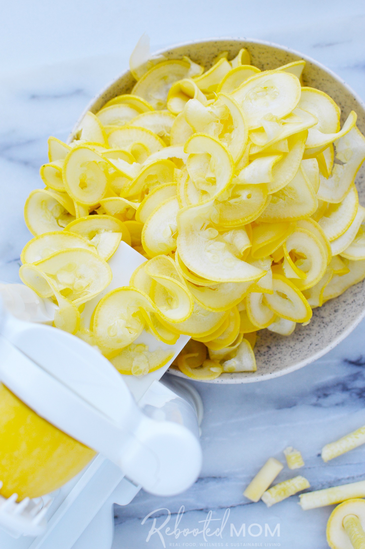 Squash Ribbons in a beautiful ceramic bowl \ These pretty sautéed yellow squash ribbons are an easy way to dress up your dinner plate and a great way to use an abundance of yellow squash! 
