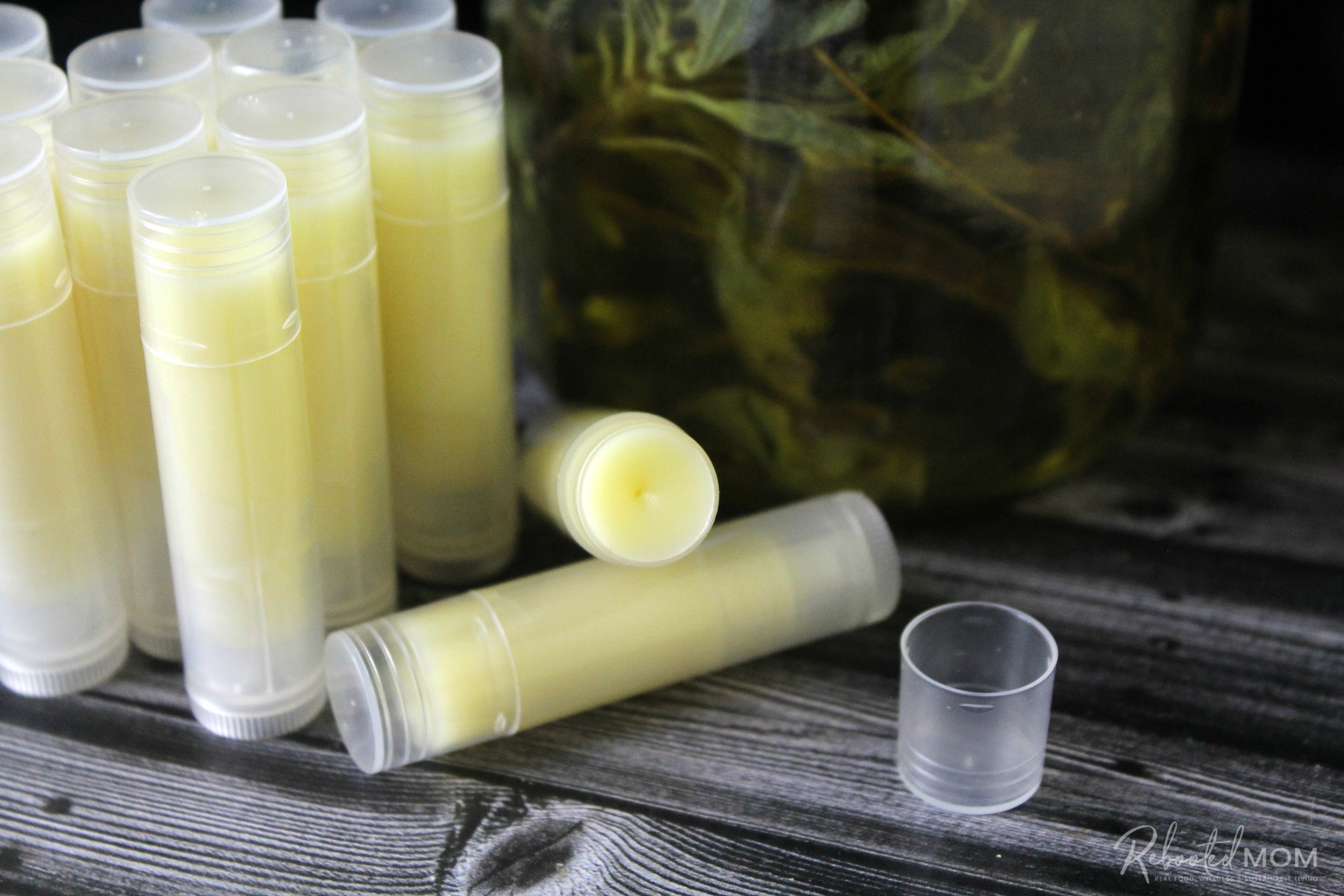 Learn how to make herbal lip balm using a simple yet flexible recipe of oils and skin-loving herbs.  This DIY makes a wonderful winter project or gift idea!