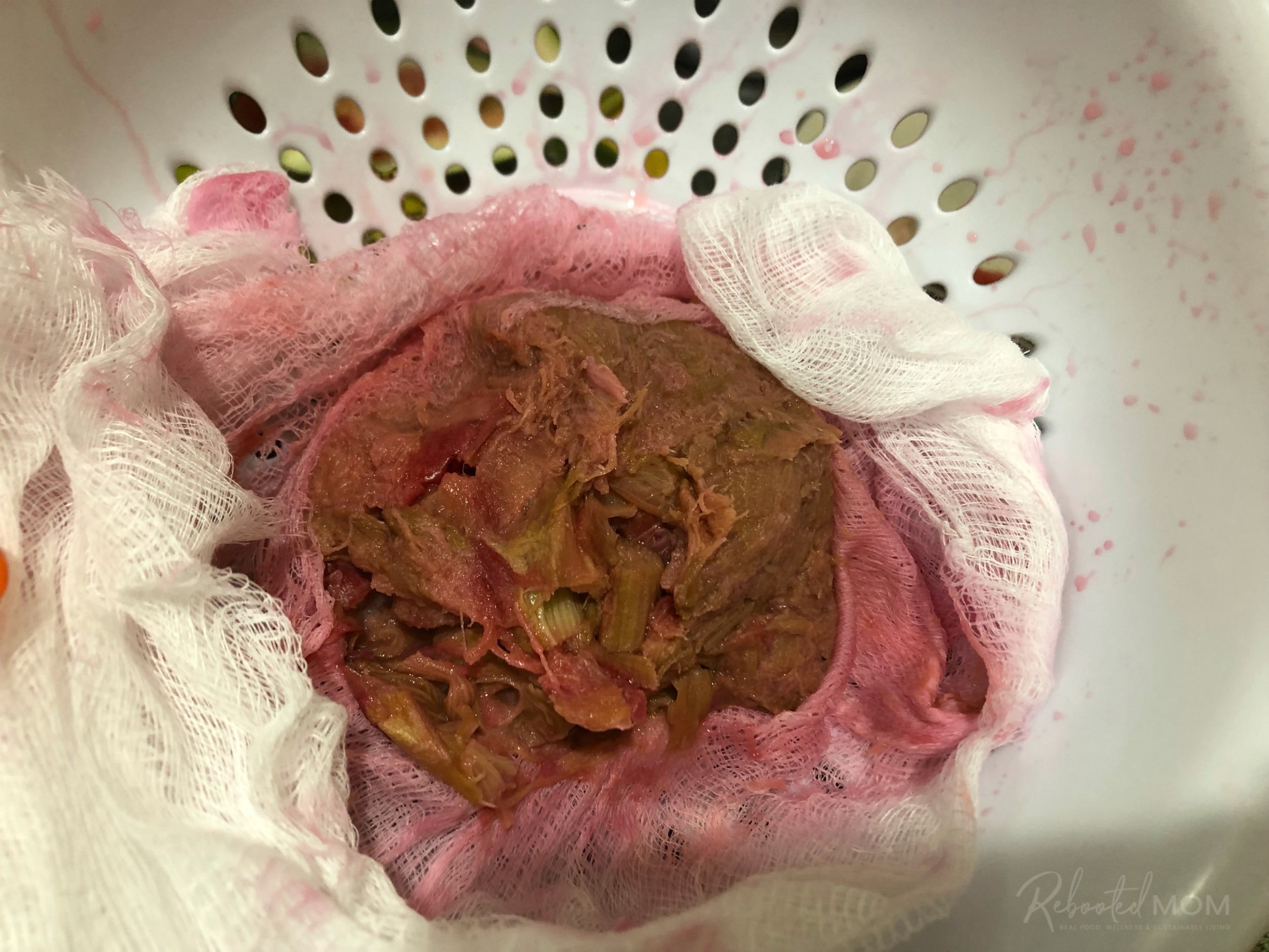 Rhubarb puree in a cheesecloth