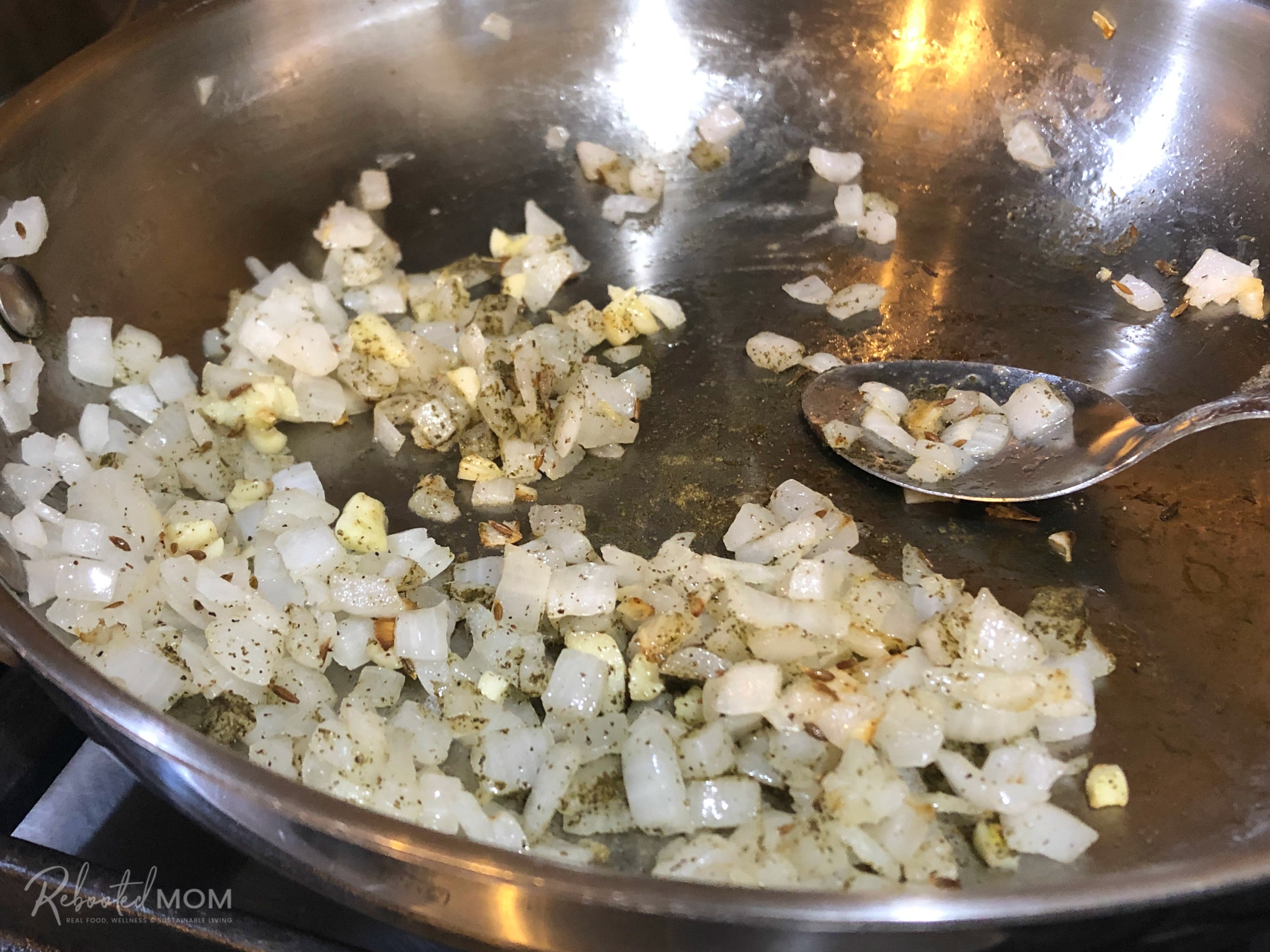 Onions, garlic and spices in a little skillet of oil on the stovetop