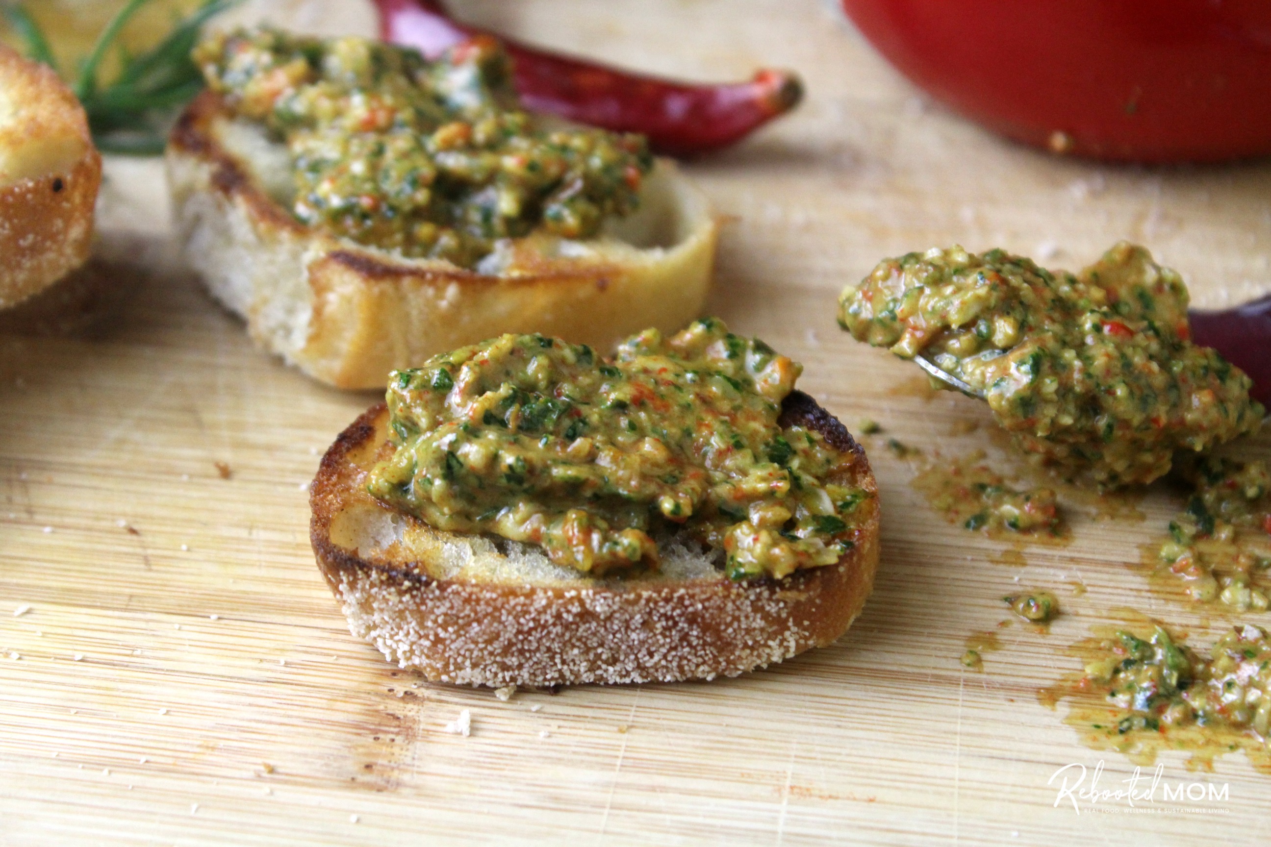 Roasted Fresno Pepper Pesto spread on a toasted baguette