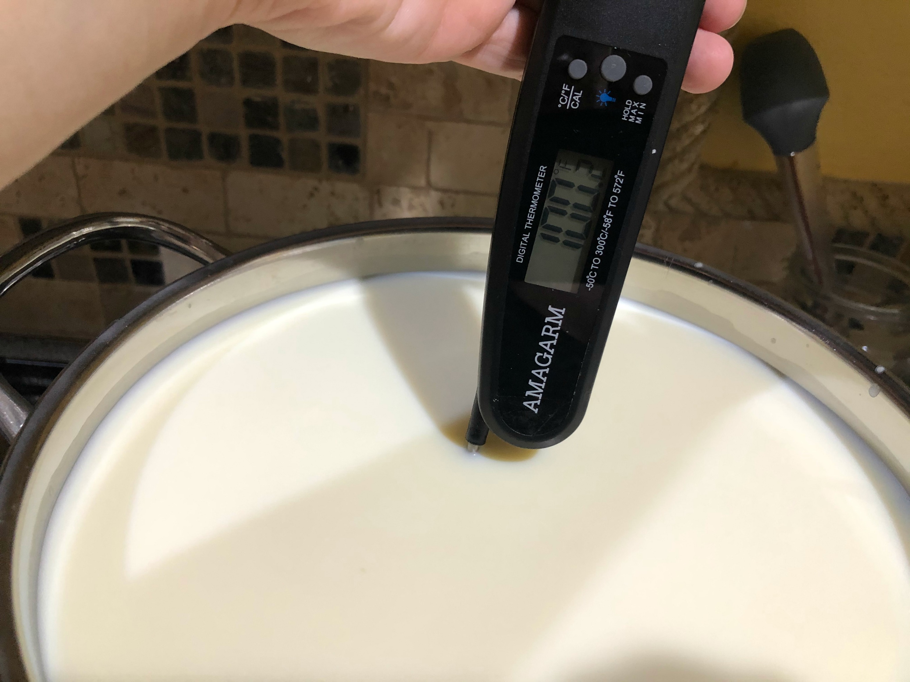 Heating the milk to make cotija cheese