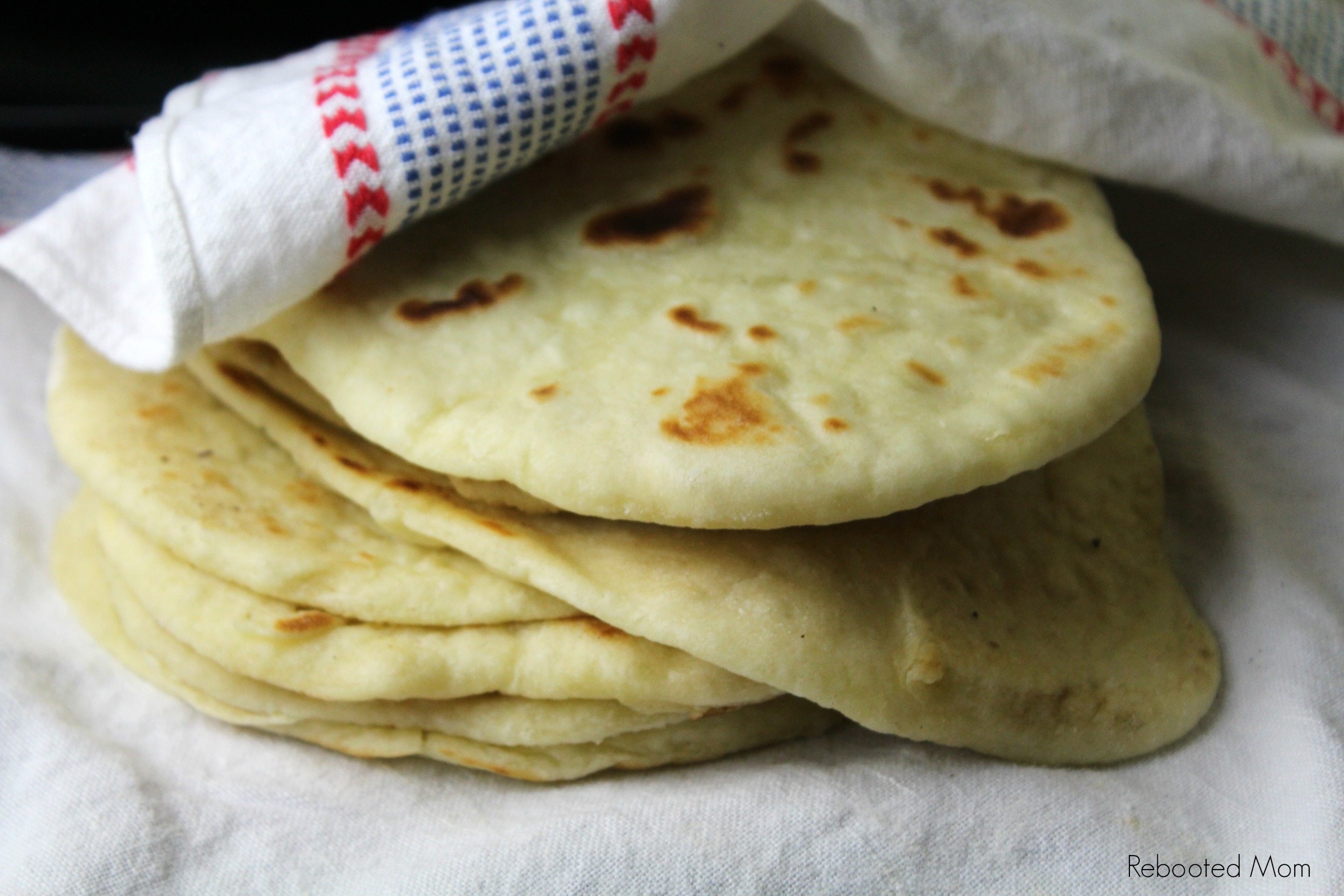 Foolproof Sourdough Naan that comes together easily with a few simple ingredients and an active sourdough starter for naan that's soft and full of flavor!  #sourdough #naan #homemade 
