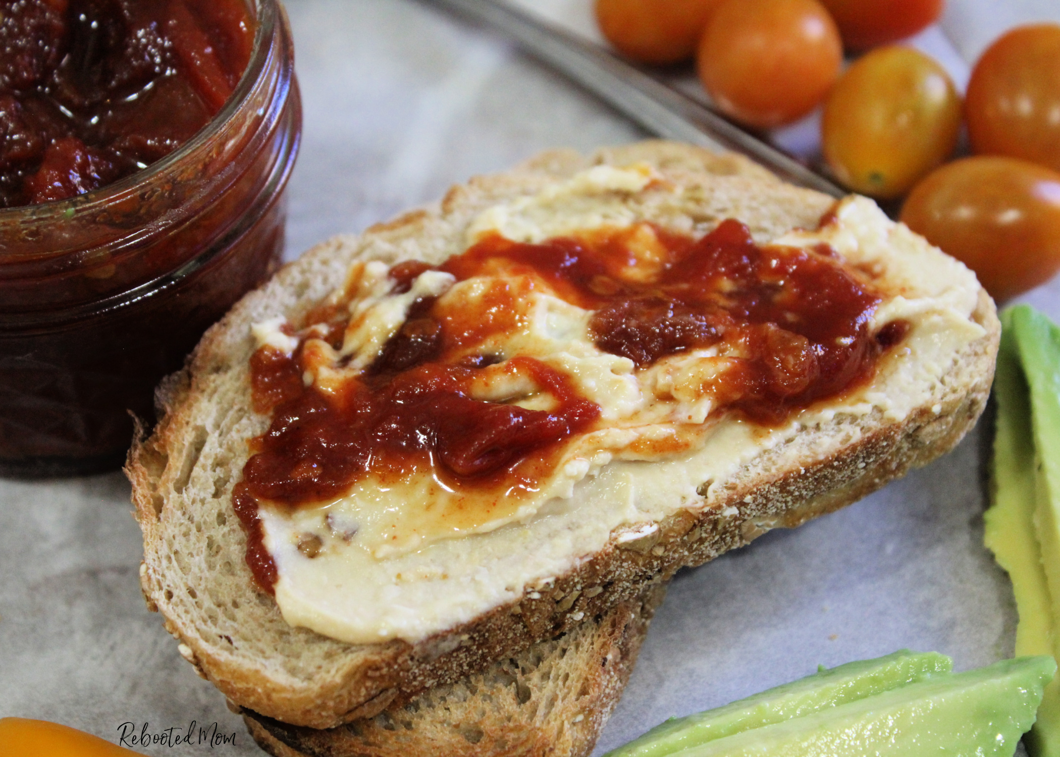 This Chipotle Tomato Jam combines the smoky flavor of chipotle chiles with garden fresh tomatoes for a jam that's unique and flavorful and perfect on toasted sourdough!