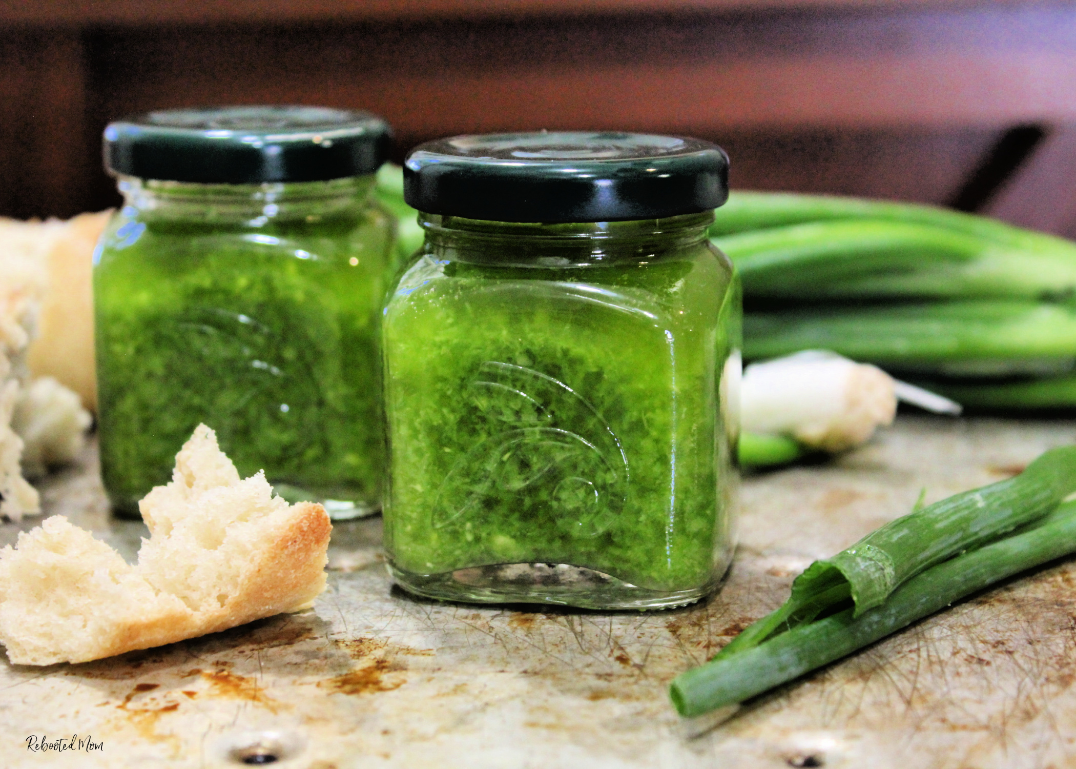 Use up an abundance of scallion greens! This Scallion Greens and Ginger Sauce comes together quickly for a bright, herby sauce that works spectacular on seafood, chicken, rice or as a dip for bread!