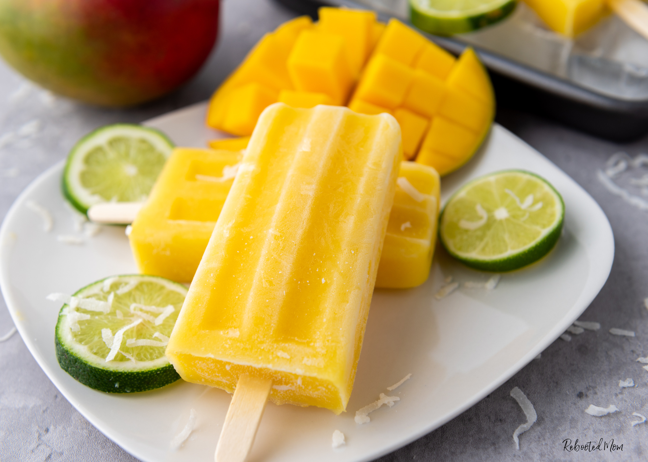 Mango Coconut Lime Popsicles that come together in mere minutes with four simple ingredients to make a treat that's absolutely out of this world delicious!