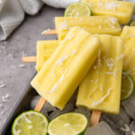 Delicious Pineapple Coconut Lime Popsicles, made with just four simple ingredients in ten minutes or less - the perfect way to welcome summer!