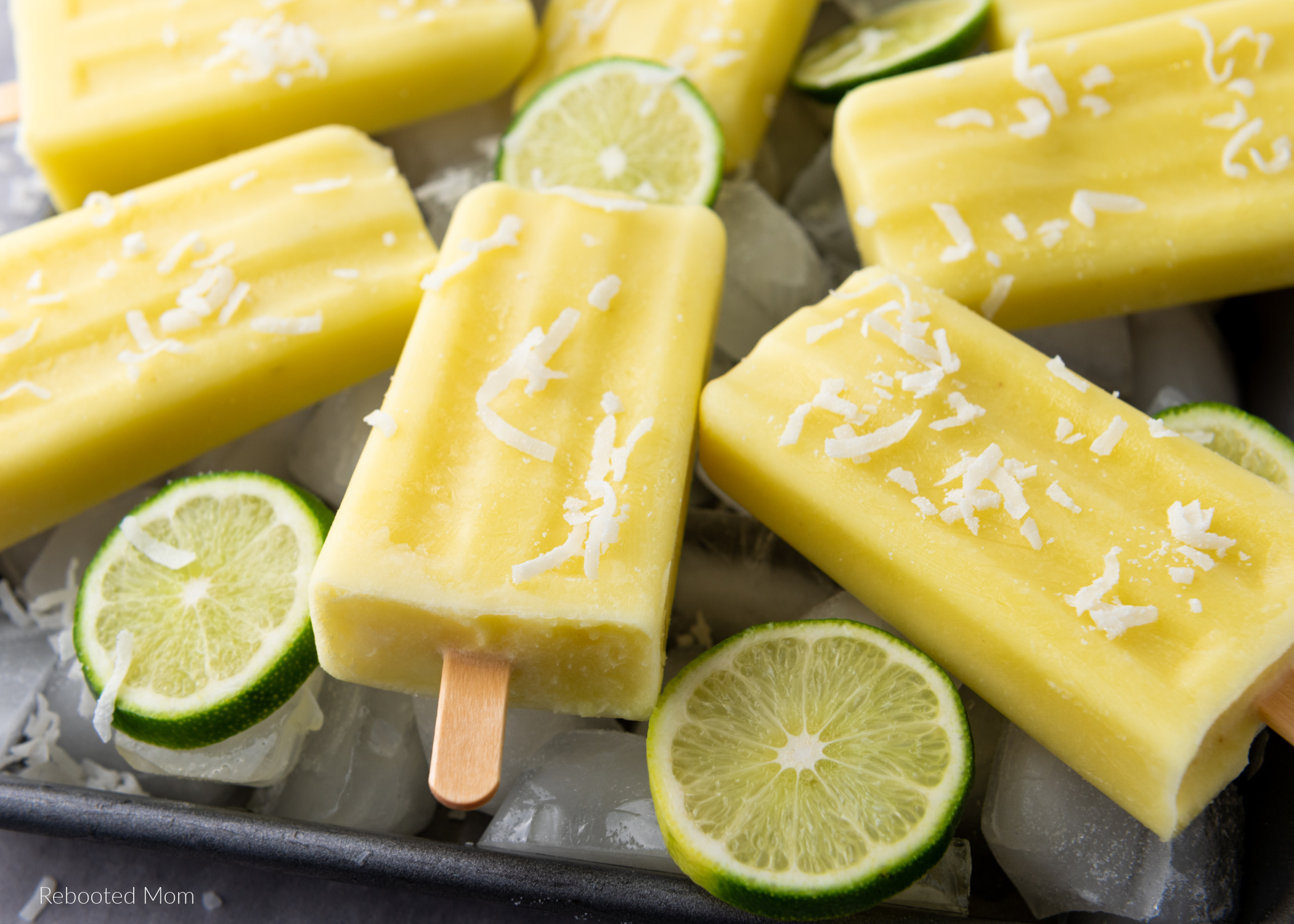 Delicious Pineapple Coconut Lime Popsicles, made with just four simple ingredients in ten minutes or less - the perfect way to welcome summer!