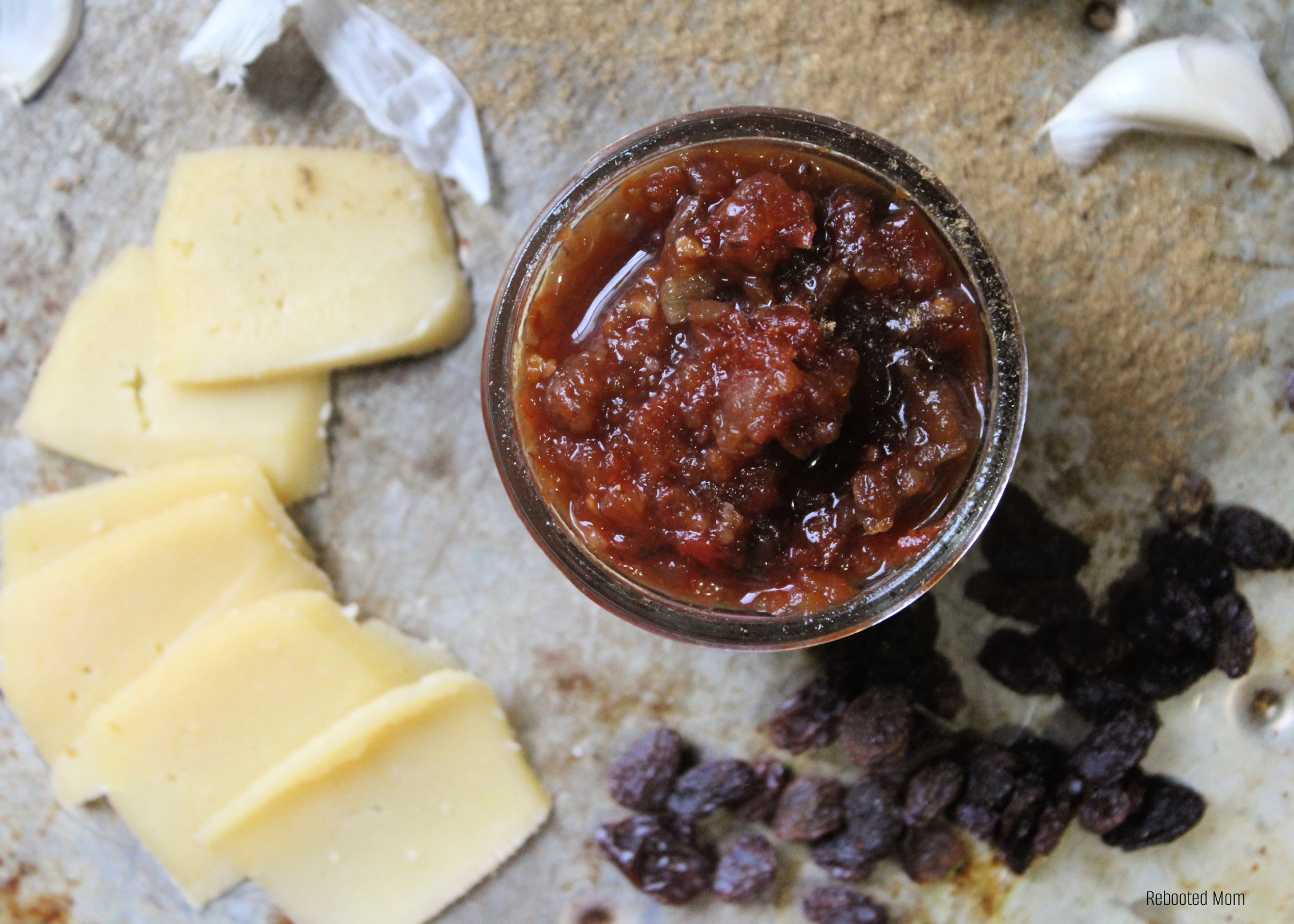 Easy and delicious Tomato Chutney recipe - the perfect way to use an abundance of garden tomatoes in a hurry and perfect condiment on meat, veggies, eggs and more! You will NEVER want to run out!