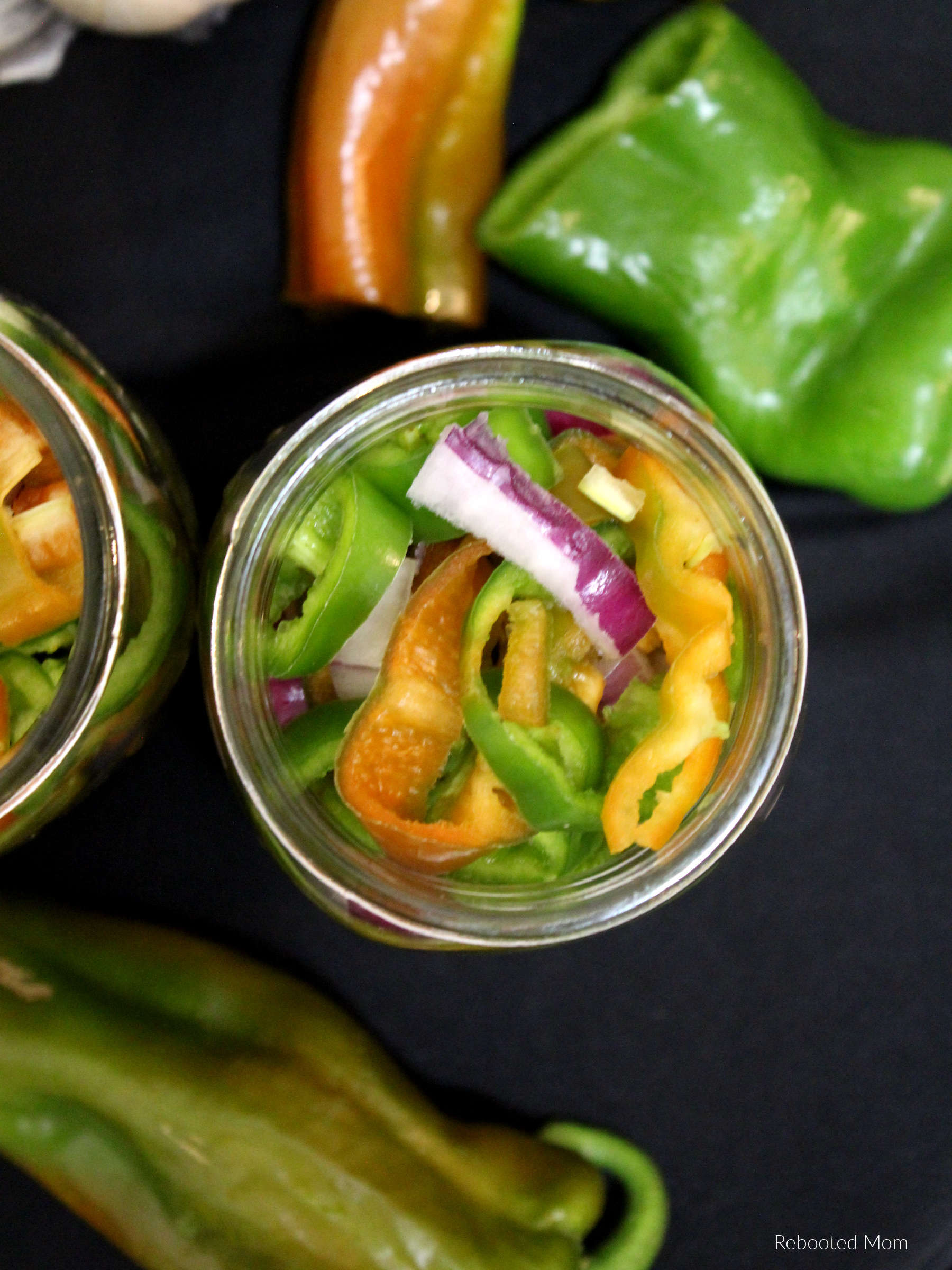 Whip up these sweet yet spicy Pickled Hatch Chiles - in ten minutes or less you can use an abundance of Chile peppers and top on burgers, fries and more!