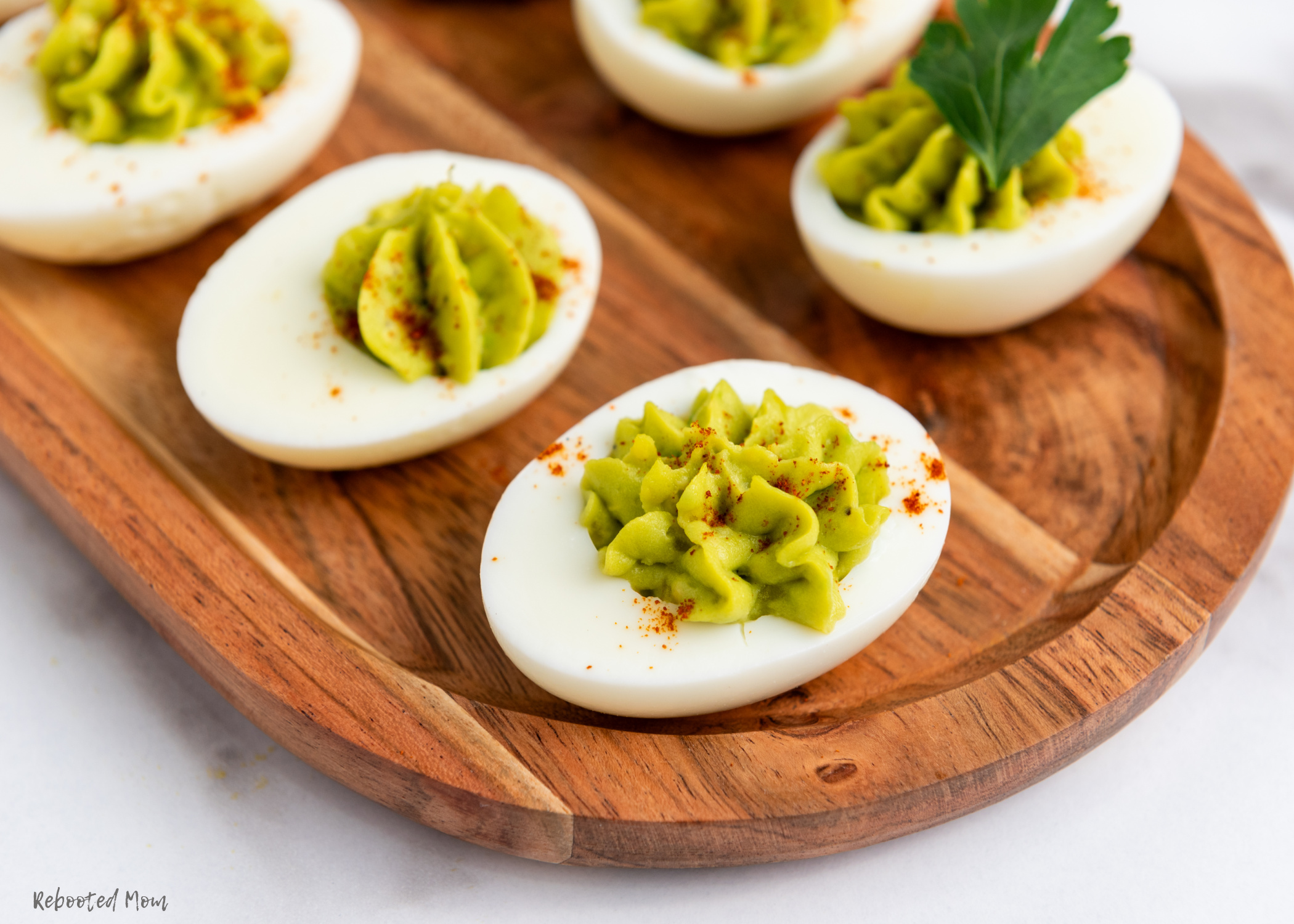 These Keto Avocado Deviled Eggs are a beautiful twist on a classic appetizer ~ brought together with just a few simple ingredients, while being keto-friendly and low-carb!