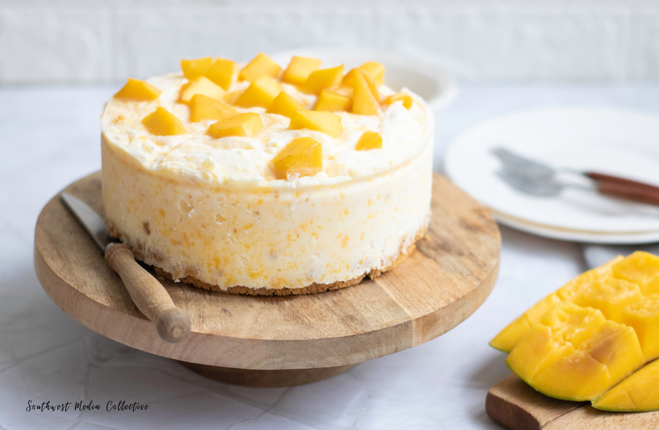 Easy and delicious Mango Cheesecake - the perfect dessert to welcome warm, summer weather!  This yummy dessert comes together quickly to create a beautiful dessert that won't fail to impress!